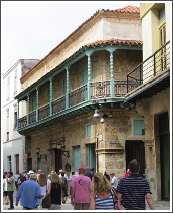 HAVANA–A stroll down Mercaderes Street passes more Colonial buildings, not quite as pristine