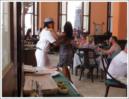 HAVANA–…with dancing patrons at a corner cafe.