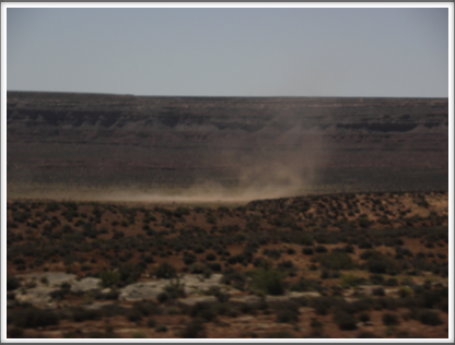 MONUMENT VALLEY, UT: dust devils race across the desert floor