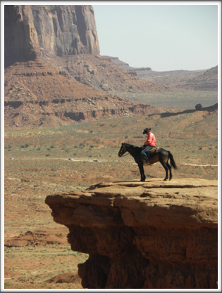 MONUMENT VALLEY: a cowboy strikes a sentimental pose for the tourists