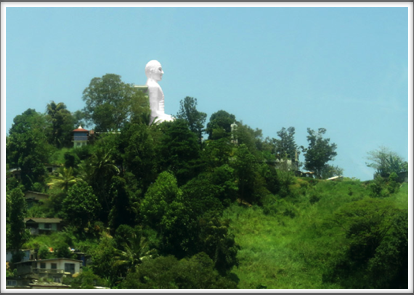 KANDY–a large Buddha image tops one of the hills