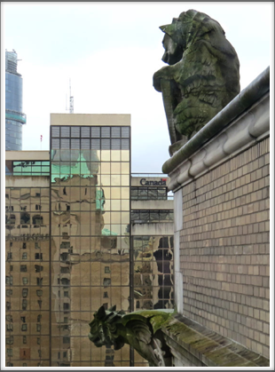 VANCOUVER–gargoyles on the historic Hotel Vancouver Fairmont ponder the modern architecture
