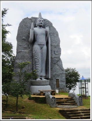 POLONNARUWA–monumental Buddha image on the shore of the Sea of Parakrama, a man-made reservoir