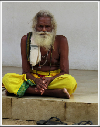 KATARAGAMA–a Saddhu (holy man) contemplates the visitors
