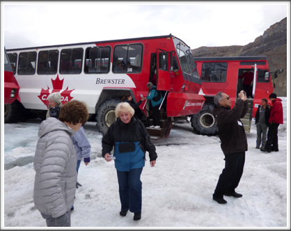 ATHABASCA GLACIER—'snowcoaches' take visitors to the surface of the glacier for a slippery stroll