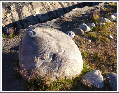 KANGAAMIUT—carved stone with Inuit designs along the path