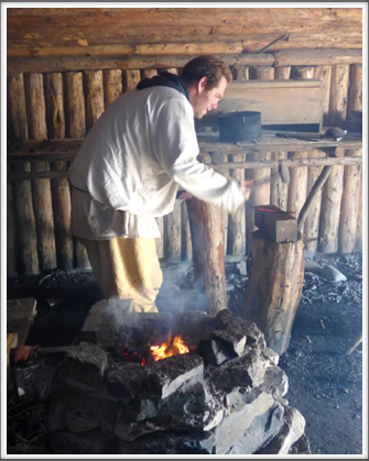L’ANSE AUX MEADOWS—a blacksmith shapes an iron hook